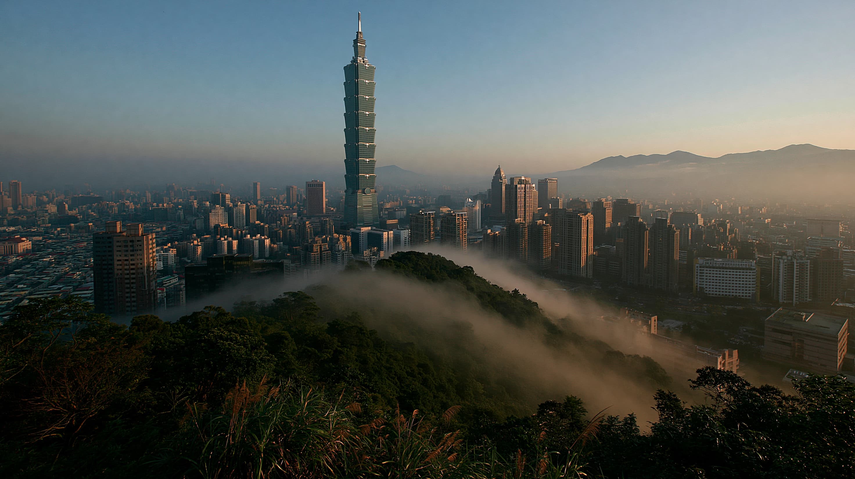 Taipei 101 skyscraper rising above the city with mountains at sunset - Taiwan entry requirements and onward ticket guide 2026